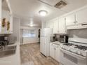 Traditional kitchen with updated appliances and tiled floors at 2929 E Main St # 471, Mesa, AZ 85213