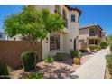 Charming home featuring well-maintained landscaping and a sidewalk leading up to the front door at 2947 N Sonoran Hls, Mesa, AZ 85207