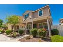 Attractive two-story home with a covered front porch, lovely landscaping, and appealing curb appeal at 3783 E Stiles Ln, Gilbert, AZ 85295