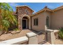 Charming entrance with stone and an arched entranceway at 3824 E Parkside Ln, Phoenix, AZ 85050