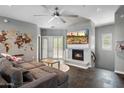 Cozy living room with comfortable seating, gas fireplace, and ample natural light at 3935 E Rough Rider Rd # 1164, Phoenix, AZ 85050