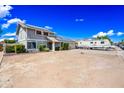 Two-story home featuring solar panels and a spacious front yard at 4136 W Hearn Rd, Phoenix, AZ 85053