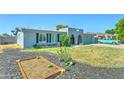 Home exterior with a garden bed in the front yard, adding to the curb appeal at 4201 W Hatcher Rd, Phoenix, AZ 85051