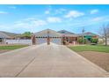 Charming single-story home with a brick facade, a spacious driveway, and a well-maintained lawn at 4304 W Calle Poco --, Laveen, AZ 85339