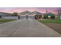 Charming single-story home with a brick facade, a spacious driveway, and a well-maintained lawn and front yard at 4304 W Calle Poco --, Laveen, AZ 85339