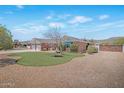 Charming single-story home with a brick facade, a spacious driveway, and a well-maintained lawn at 4304 W Calle Poco --, Laveen, AZ 85339