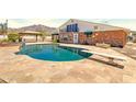 Enjoy a private backyard with a large pool, diving board, and covered patio perfect for outdoor entertaining at 4304 W Calle Poco --, Laveen, AZ 85339