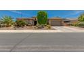 Charming single-story home with well-manicured desert landscaping and a spacious two-car garage at 5085 S Ponderosa Dr, Gilbert, AZ 85298