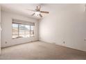 Bright bedroom with a large window providing natural light and neutral walls at 548 W Linda Ln, Chandler, AZ 85225