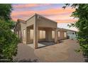 A spacious backyard with a paved patio area, perfect for outdoor entertaining and relaxation at 6781 W Lone Cactus Dr, Glendale, AZ 85308