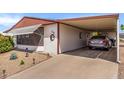Attached carport showcasing a home's practical parking solution and easy access at 8103 E Southern Ave # 75, Mesa, AZ 85209