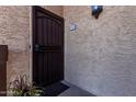 Close up of front door with security screen and front door with address on sign at 10410 N Cave Creek Rd # 2030, Phoenix, AZ 85020