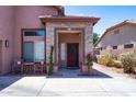 Inviting front porch with decorative stone accents and a charming wreath on the front door at 13709 W Rovey Ave, Litchfield Park, AZ 85340