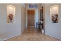 Elegant foyer with tile flooring, niche displays, and a decorative entry table at 16333 E Crystal Point Dr, Fountain Hills, AZ 85268