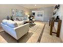 Inviting living room with neutral colors, tile floor, comfortable seating, and stylish decor for relaxed living at 1661 E Bishop Dr, Tempe, AZ 85282
