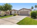 Lovely home featuring a two-car garage, desert landscaping, and a welcoming entrance at 1680 S Arroyo Ln, Gilbert, AZ 85295