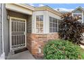 Charming entryway featuring a decorative security door and colorful landscaping at 18644 N 5Th Ave, Phoenix, AZ 85027