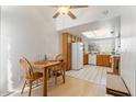 Eat-in kitchen showcasing ample natural light, wood cabinets, and tile flooring at 18644 N 5Th Ave, Phoenix, AZ 85027