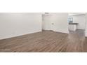 Spacious living room with stylish laminate flooring, fresh paint and abundant natural light at 2220 S Cottonwood Dr, Tempe, AZ 85282