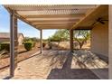 Enjoy outdoor living under the covered patio with a view of the serene desert landscape at 22417 W Loma Linda Blvd, Buckeye, AZ 85326