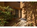 Inviting entryway featuring a decorative rug and desert landscaping at 25555 N Windy Walk Dr # 34, Scottsdale, AZ 85255