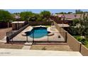 Beautiful pool with a diving board, fenced-in yard, and ample space for outdoor entertaining at 2634 S 63Rd Dr, Phoenix, AZ 85043