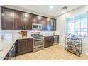 Gourmet kitchen featuring stainless steel appliances and granite countertops at 277 E Kaibab Dr, Chandler, AZ 85249