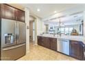 Spacious kitchen with stainless steel refrigerator and a breakfast bar at 277 E Kaibab Dr, Chandler, AZ 85249