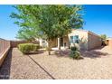 The backyard features low-maintenance desert landscaping, rock cover, and a covered patio space at 37252 N Big Bend Rd, San Tan Valley, AZ 85140