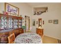 Elegant dining area showcases a china cabinet and a floral tablecloth at 6102 E Inglewood St, Mesa, AZ 85205