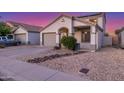 Attractive exterior of home showcasing desert landscaping, two-car garage, and inviting entrance at 7319 S 56Th Dr, Laveen, AZ 85339
