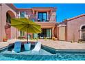Inviting backyard pool with in-pool lounge chairs and umbrellas at 7530 N Via De La Siesta --, Scottsdale, AZ 85258