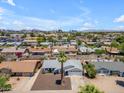 An aerial shot showcases the residential neighborhood with mountain views at 1020 E Concorda Dr, Tempe, AZ 85282