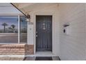 Close-up of the front door of a home with brick accents and a mailbox at 1020 E Concorda Dr, Tempe, AZ 85282