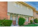Charming exterior with brick accents, green shrubs, and well maintained yard at 1385 N 44Th St, Phoenix, AZ 85008