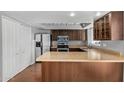 Well-lit kitchen features stainless steel appliances, and tile countertops at 1385 N 44Th St, Phoenix, AZ 85008