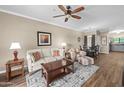Cozy living room featuring ceiling fan, neutral tones, and ample natural light at 1941 S Pierpont Dr # 2015, Mesa, AZ 85206