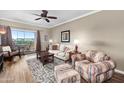 Comfortable living room with ceiling fan and balcony access at 1941 S Pierpont Dr # 2015, Mesa, AZ 85206