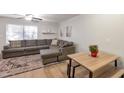 Cozy living room with plush sectional sofa, stylish rug, and natural light enhancing a comfortable ambiance at 2301 E University Dr # 256, Mesa, AZ 85213