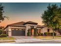 Beautiful single-Gathering home boasts mature trees, a tile roof, and an attached two-car garage at 2623 E Indigo Pl, Chandler, AZ 85286