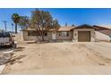Charming single-story home featuring a tan exterior, tidy landscaping, and a single-car garage at 3562 W Seldon Ln, Phoenix, AZ 85051