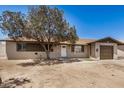 Charming single-story home featuring a tan exterior, tidy landscaping, and a single-car garage at 3562 W Seldon Ln, Phoenix, AZ 85051