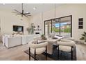 Stylish dining area with modern table, comfortable chairs, and sliding glass doors to the outdoors at 9820 N 87Th Pl, Scottsdale, AZ 85258