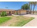 Inviting single-story home featuring solar panels, desert landscaping and an attached two-car garage at 10236 N 105Th Dr, Sun City, AZ 85351