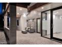 Charming entrance featuring an outdoor sitting area with stylish furniture and gray brick accents at 11007 N 26Th St, Phoenix, AZ 85028