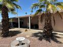 Exterior view of single story home showing covered carport and mature landscaping at 11411 N 91St Ave # 229, Peoria, AZ 85345