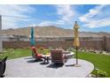 Inviting patio area with comfortable seating and a fire pit, perfect for outdoor entertaining against a mountain backdrop at 14507 N Valencia Dr, Fountain Hills, AZ 85268