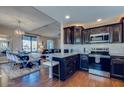 Stylish kitchen and dining area with modern fixtures, stainless appliances, and hardwood floors at 15252 N 100Th St # 2157, Scottsdale, AZ 85260