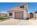 View of the home's front exterior, including the garage, fresh exterior paint and small front lawn at 1605 W Curry Dr, Chandler, AZ 85224