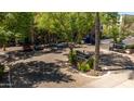 Well-maintained entrance featuring lush landscaping and inviting signage for residents and visitors at 1701 E Colter St # 147, Phoenix, AZ 85016